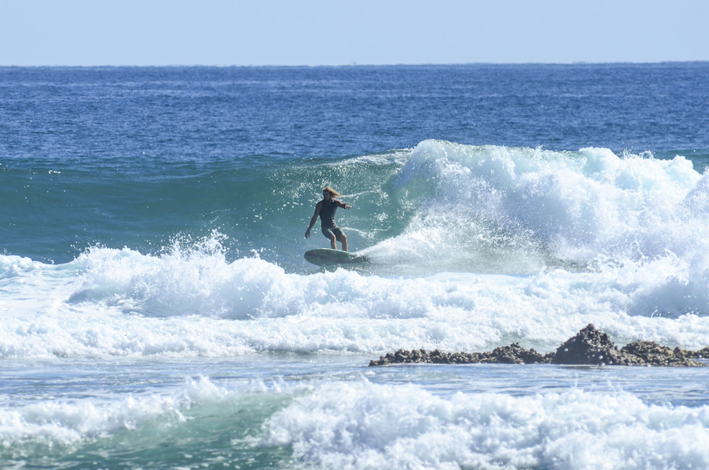 A surfer on the wave at Punto Abreojos